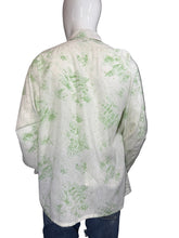 Load image into Gallery viewer, White garment with green pattern on a mannequin against a gray background