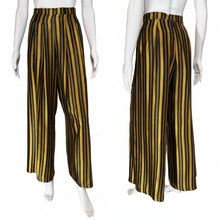 Load image into Gallery viewer, Black and yellow striped pants on mannequins with a neutral background