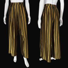 Load image into Gallery viewer, Black and yellow striped pants on mannequins with a neutral background