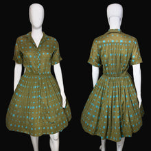 Load image into Gallery viewer, Green and blue patterned dress on a mannequin