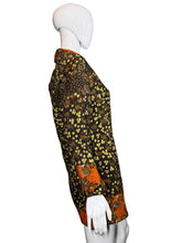 Load image into Gallery viewer, Mannequin wearing a patterned garment against a plain wall.