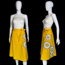 Load image into Gallery viewer, Yellow skirt with a white floral applique against a white background.
