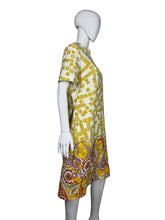 Load image into Gallery viewer, Yellow and white patterned dress on a mannequin