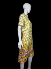 Load image into Gallery viewer, Yellow and white patterned dress on a mannequin