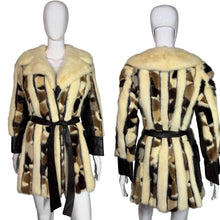 Load image into Gallery viewer, Fur coat with a patterned design on a mannequin against a plain background