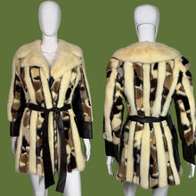 Load image into Gallery viewer, Fur coat with a patterned design on a mannequin against a plain background