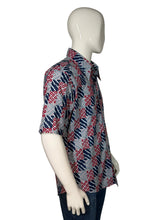 Load image into Gallery viewer, Mannequin wearing a patterned shirt on a plain background