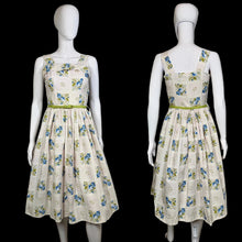 Load image into Gallery viewer, Floral dress on a mannequin against a neutral background