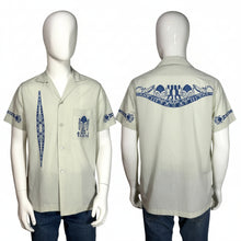 Load image into Gallery viewer, Light gray shirt with blue patterns on a mannequin against a gray background