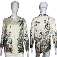 Load image into Gallery viewer, Mannequin wearing a patterned shirt with long sleeves on a plain background