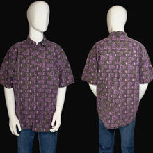 Load image into Gallery viewer, Short-sleeve shirt with a purple geometric pattern on a mannequin against a neutral background