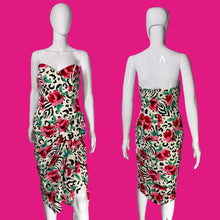 Load image into Gallery viewer, A strapless dress displayed on a white mannequin, shown from both the front and back. The dress features a vibrant floral and animal print with red roses, green leaves, black leopard spots.