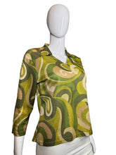 Load image into Gallery viewer, Mannequin wearing a green patterned garment on a white background