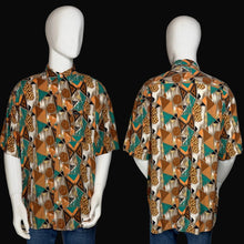 Load image into Gallery viewer, Mannequin wearing a patterned shirt with a brown and teal geometric design