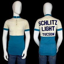 Load image into Gallery viewer, Mannequin wearing a vintage cycling jersey with 'Schlitz Light Tucson' text on a plain background
