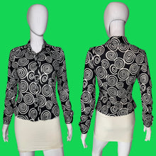 Load image into Gallery viewer, Black long-sleeve blouse with a white spiral swirl pattern, shown on a white mannequin from both front and back views