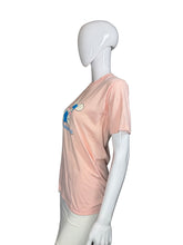 Load image into Gallery viewer, Mannequin wearing a pink t-shirt with cartoon character design on a plain background