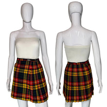 Load image into Gallery viewer, Front and back view of a plaid skirt on a mannequin