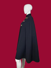 Load image into Gallery viewer, Navy blue cape with gold buckles on a mannequin against a plain background