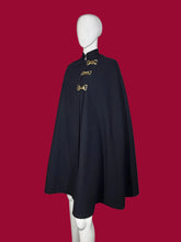 Load image into Gallery viewer, Navy blue cape with gold buckles on a mannequin against a plain background