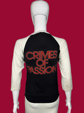 Load image into Gallery viewer, Black t-shirt with 'CRIMES OF PASSION' text on a mannequin against a gray background