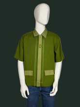 Load image into Gallery viewer, Green shirt on a mannequin against a plain background