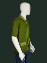 Load image into Gallery viewer, Green shirt on a mannequin against a gray background