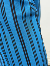 Load image into Gallery viewer, Close-up of blue fabric with black stripes with light discoloration