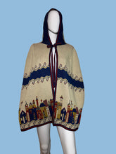 Load image into Gallery viewer, Decorative hooded cape with intricate patterns on a white mannequin