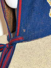 Load image into Gallery viewer, Close-up of a woven fabric with blue and red patterns on a white background