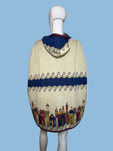 Load image into Gallery viewer, Decorative hooded cape with colorful patterns on a mannequin against a plain background