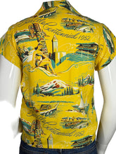 Load image into Gallery viewer, Yellow shirt with vintage-style design on a mannequin