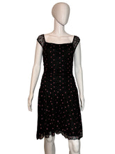 Load image into Gallery viewer, Black polka dot dress on a mannequin against a plain background