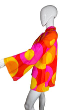 Load image into Gallery viewer, Mannequin wearing a colorful dress with pink, yellow, and orange pattern on a plain background
