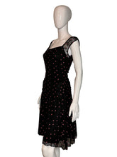 Load image into Gallery viewer, Black dress with pink polka dots on a mannequin against a white background