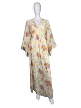 Load image into Gallery viewer, Floral dress on a mannequin against a plain background
