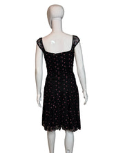 Load image into Gallery viewer, Black polka dot dress on a white mannequin against a plain background