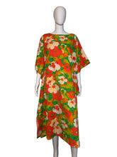 Load image into Gallery viewer, Colorful floral dress on a mannequin against a white wall.