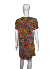 Load image into Gallery viewer, Floral dress on a mannequin against a plain background