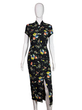 Load image into Gallery viewer, Mannequin wearing a black dress with colorful floral pattern on a white background