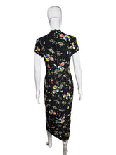 Load image into Gallery viewer, Floral dress on a mannequin against a white wall