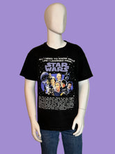 Load image into Gallery viewer, Mannequin wearing a black 'Star Wars' t-shirt with character images and text.