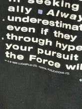 Load image into Gallery viewer, Close-up on manufacturing date on t-shirt