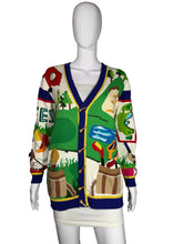 Load image into Gallery viewer, Colorful sweater with golf-themed design on a mannequin against a gray background