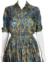 Load image into Gallery viewer, Floral patterned dress on a mannequin against a white background