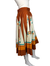 Load image into Gallery viewer, Skirt with a floral pattern on a mannequin against a plain background