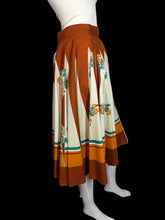 Load image into Gallery viewer, Skirt with a floral pattern on a mannequin against a plain background
