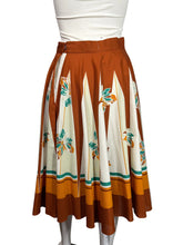Load image into Gallery viewer, Skirt with a floral pattern on a mannequin against a plain background