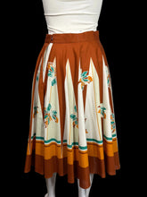 Load image into Gallery viewer, Skirt with a floral pattern on a mannequin against a plain background