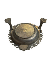 Load image into Gallery viewer, Decorative metal ashtray with intricate designs on a white background